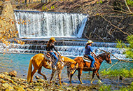 Two people on horseback